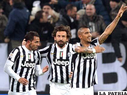Tévez, Pirlo y Vidal, jugadores de Juventus