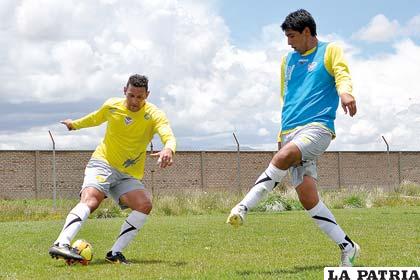 Neumann y Ferrufino en el entrenamiento de ayer
