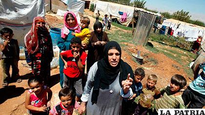 Mujeres y niños sirios que encontraron como refugio a Egipto