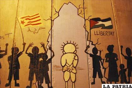 Grafiti de Handala -un personaje palestino de viñeta- en el muro de separación construido por Israel en Cisjordania.EFE