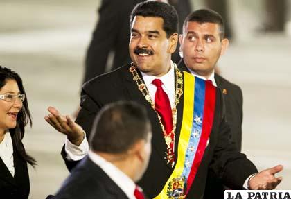 Presidente de Venezuela, Nicolás Maduro (c)