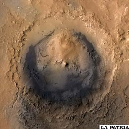 En la parte superior de la imagen una elipse marca el sitio elegido para el descenso del Curiosity en las proximidades del cráter Gale FOTO NASA/JPL/ Caltech/MSSS