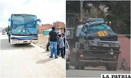 El bus parado en la vía, mientras que una grúa remolca la vagoneta