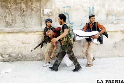 Siguen los combates entre las fuerzas gubernamentales sirias y los rebeldes