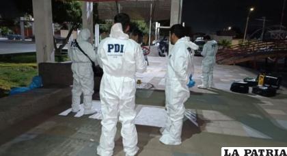Funcionarios policiales verifican la escena del crimen / PDI