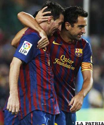 Messi y Xavi del Barcelona